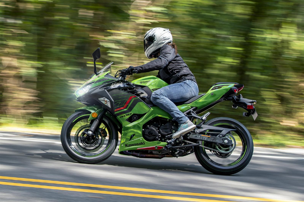 Dynamic riding shot of the Kawasaki Ninja 400.