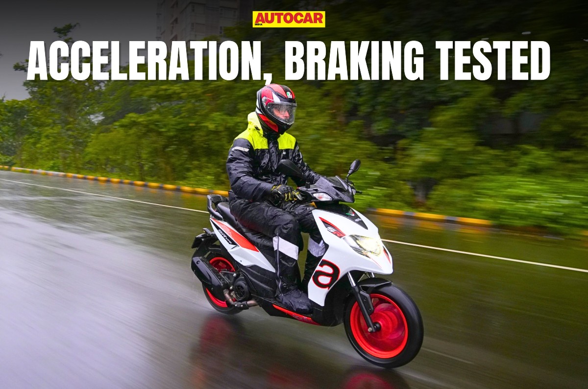 Aprilia SR 175 front right angle riding shot in rain