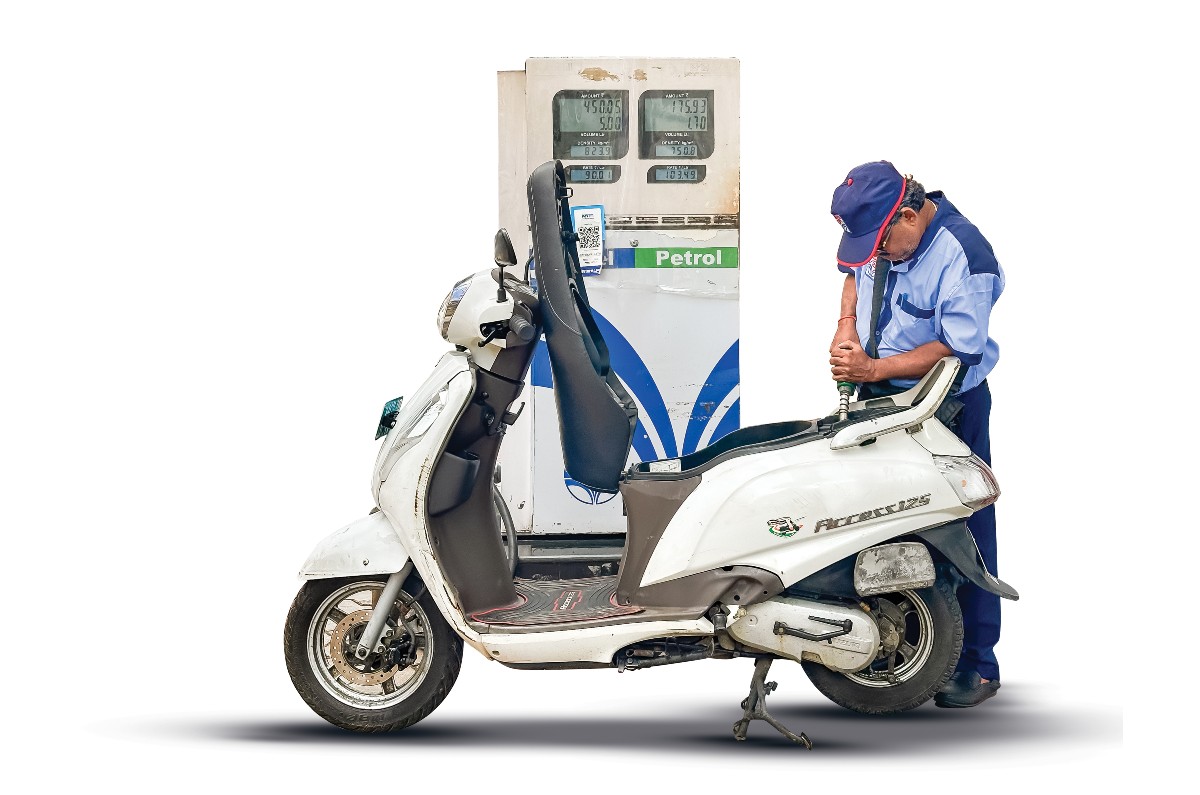 Suzuki Access filling petrol at a fuel pump in India