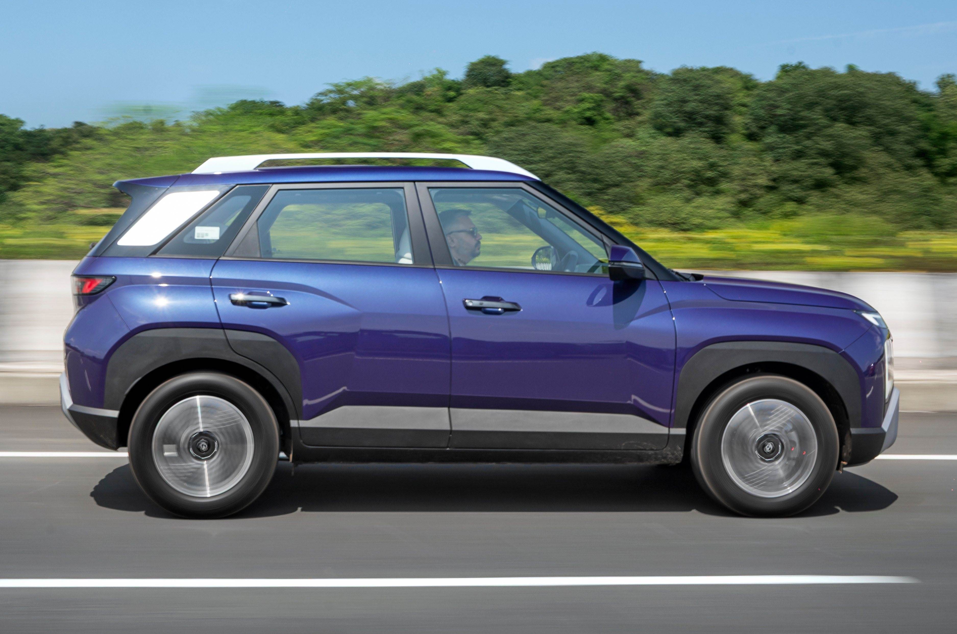 2025 Hyundai Venue side profile driving on road