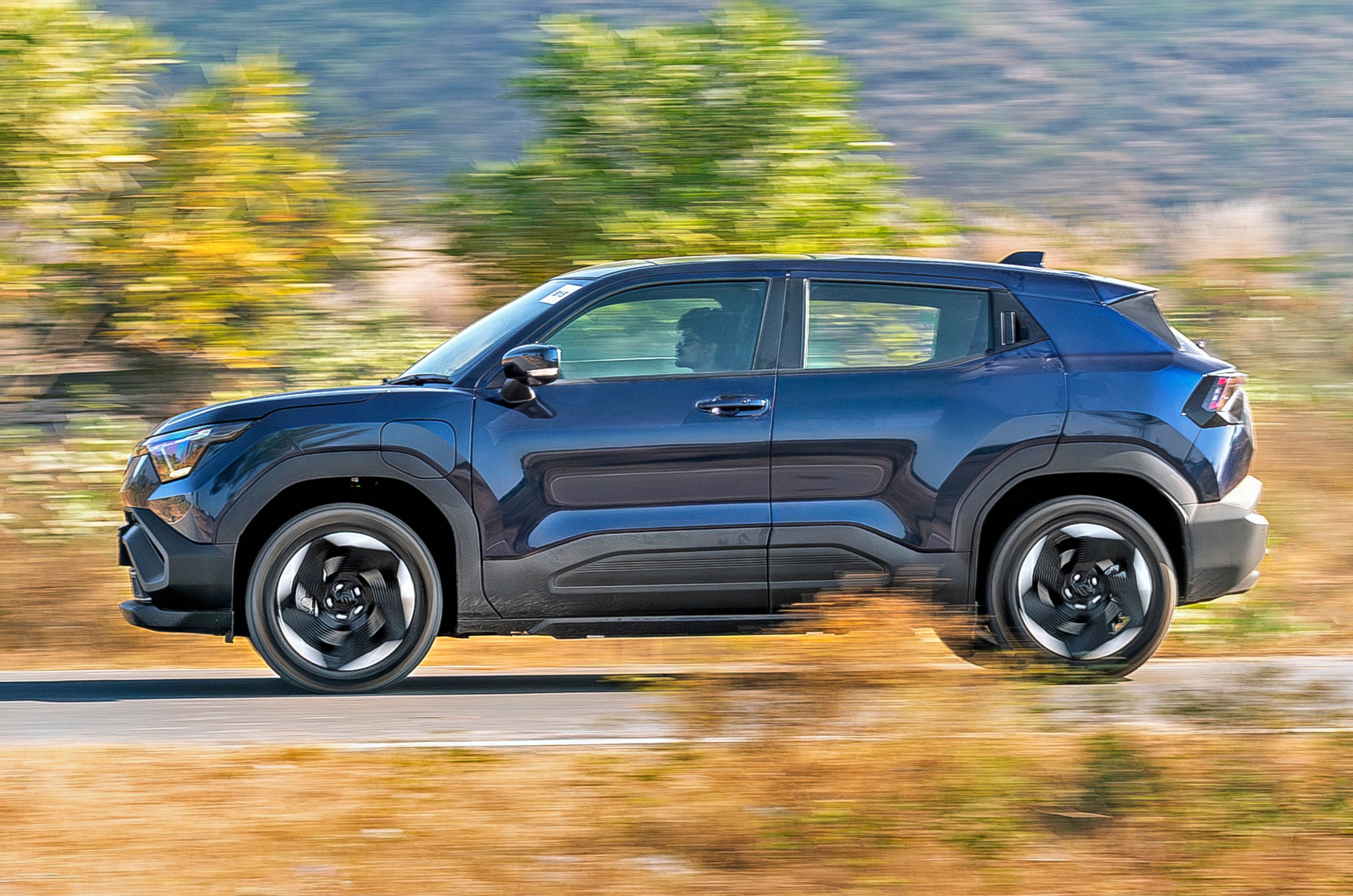 Maruti e Vitara side profile driving on road