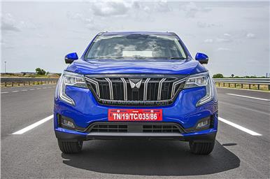 Large, chrome-embellished front grille houses the new Mahindra SUV logo. 
