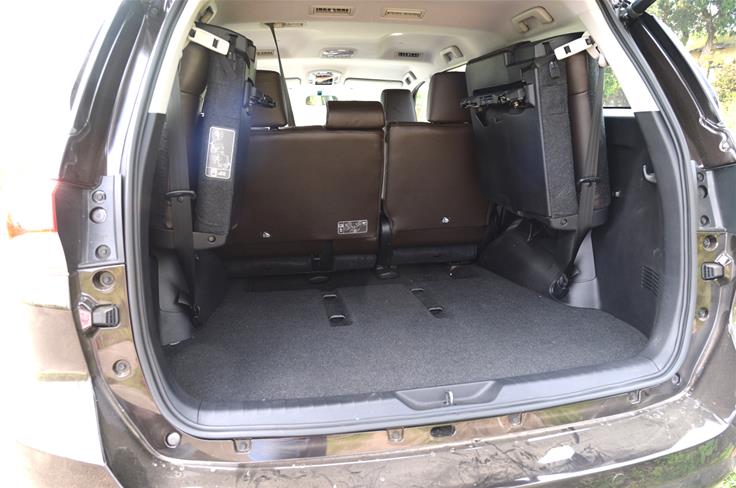 With a mere tug of a strap, the third row seats can be individually lifted up to liberate more cargo area.
