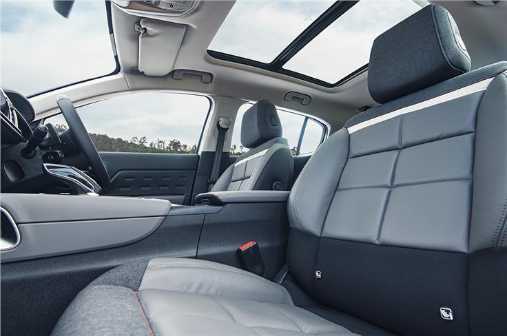 Driver's seat is power adjustable while front passenger gets manual adjust. Upholstery a mix of Metropolitan Grey grained leather and graphite cloth inserts.
