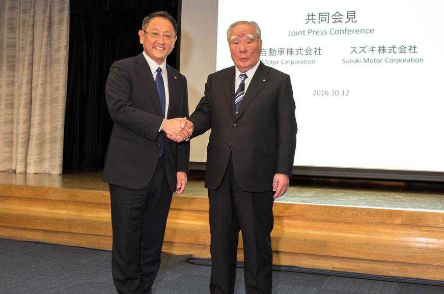 (L-R) Toyota president Akio Toyoda and Osamu Suzuki, chai...