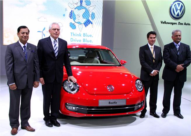 VW unveils Beetle, XL1, launches Touareg