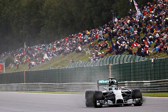 Rosberg beats Hamilton to pole at wet Spa