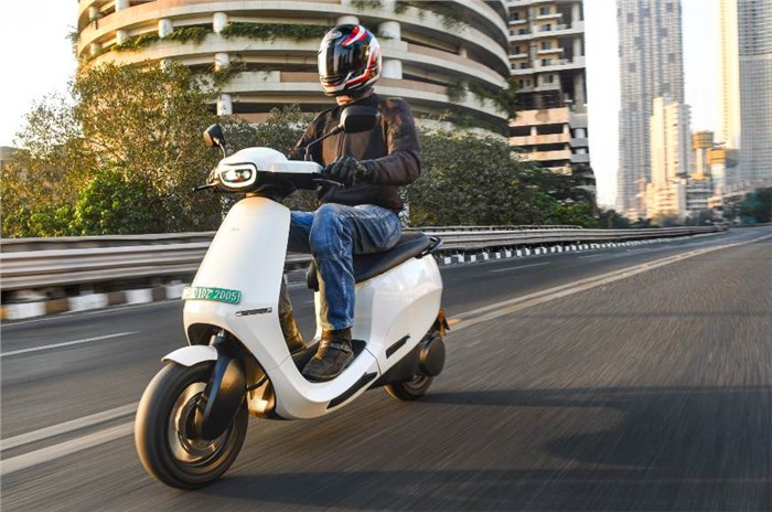 A front three-quarter tracking shot of the Ola S1 Pro electric scooter in white.