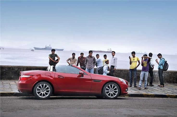 October 2011: Striking a pose near the Gateway of India, the sexy Mercedes SLK gets more attention than the leggy lasses from tinsel town.