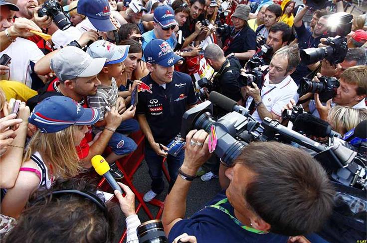 These days Vettel is a big draw at grands prix, as an impromptu autograph session at Alonso-crazy Barcelona proves.