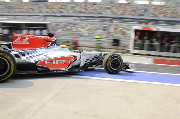Narain Karthikeyan leaves the HRT pit garage for his first lap of the Buddh Circuit.