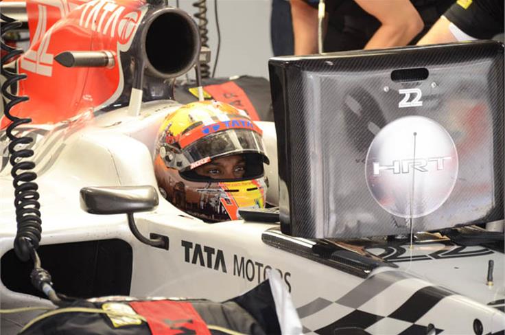 Narain Karthikeyan keeps an eye on the proceedings from his cockpit during the free practice session.