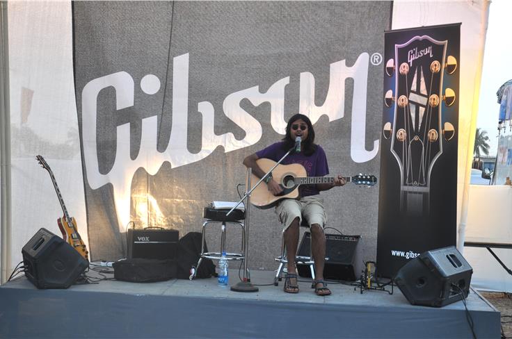 The Gibson stall. Anyone could pick up a guitar and strum away.
