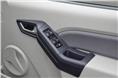 Top-end variant features all four power windows. Thick door pads can also double up as an armrest.