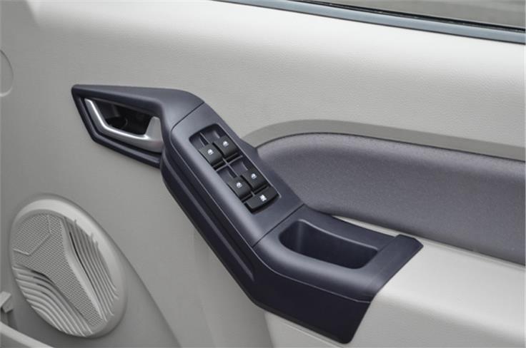 Top-end variant features all four power windows. Thick door pads can also double up as an armrest.