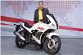 Mr. Munjal poses with the brand's new 2014 Karizma ZMR