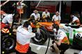 Force India mechanics practice pit stops.
