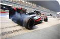 Jenson Button lays rubber in his pitbox during practice.