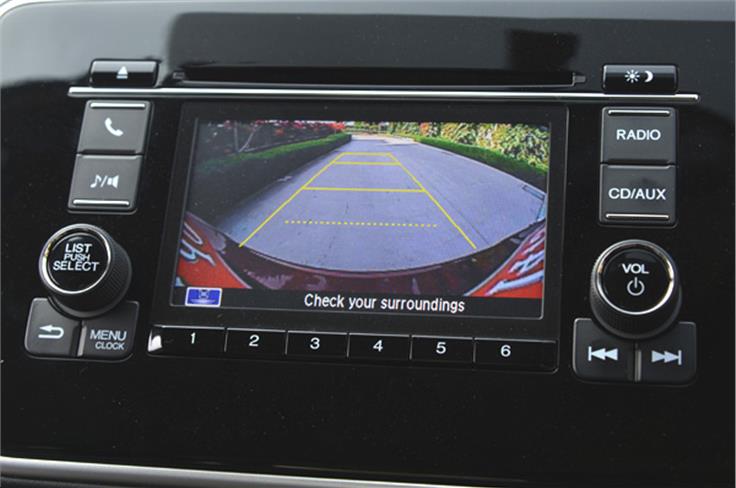 The 8-speaker sound system with with USB, aux-in inputs and a CD player along with screen that doubles up as a reverse camera display.