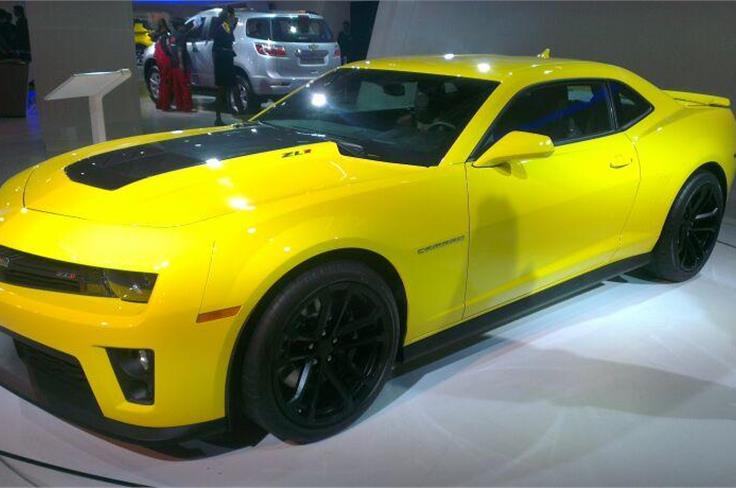 A smashing yellow Chevrolet Camaro is on display at the Chevrolet stall