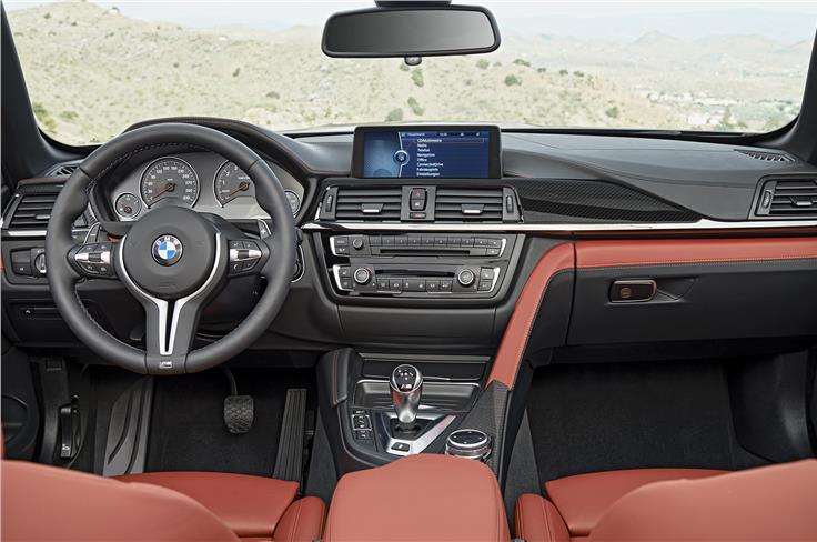 Like all current BMW coup&#233;s and convertibles, the M4 gets a central console similar to its sedan counterpart (the M3), but with a sportier, more driver-focussed design.