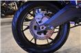 Rear disc brake mounted on an alloy section swingarm. 