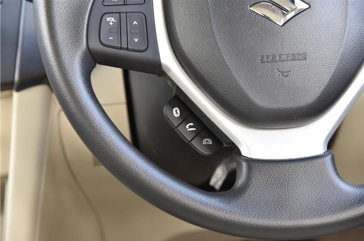 Steering mounted audio-controls standard on top-trims. Note Bluetooth telephony controls. 