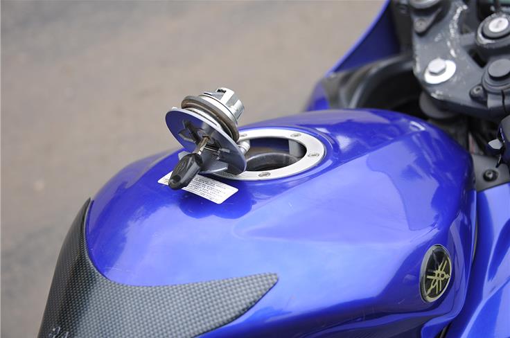Yamaha also equips its YZF-R15 with a hinged fuel-filler cap.