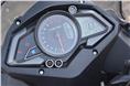 The Bajaj Pulsar AS 150 gets digi-analogue instruments, a useful side-stand engaged sign, clock and a shift-warning light.