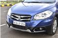 The S-Cross gets a dual-slat chrome grille along with chrome inserts around the fog lamps.