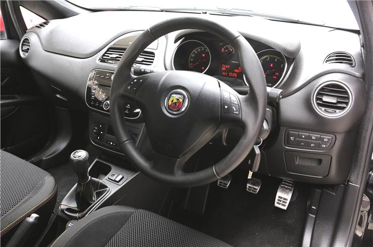 The interior is more or less unchanged save for the Abarth badging and sportier steel pedals.