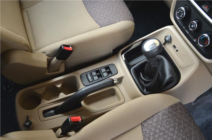 The power window switches mounted near the handbrake are borrowed from the Scorpio.