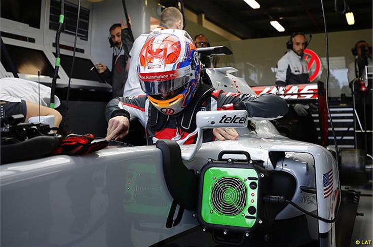 Romain Grosjean climbs into the Haas, Australian Grand Prix practice 2016
