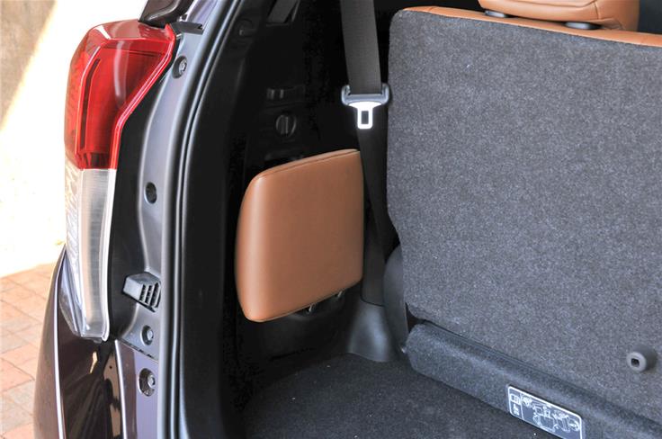&#8211; The third row&#8217;s middle headrest stows neatly in the side of the boot when not needed.