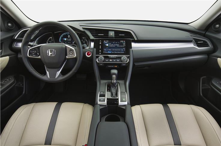 The Civic&#8217;s upmarket cabin is neat and minimalist.