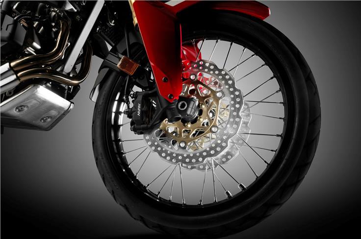 The Africa Twin rides on wire spoke wheels to stay true to its off-road credentials.
