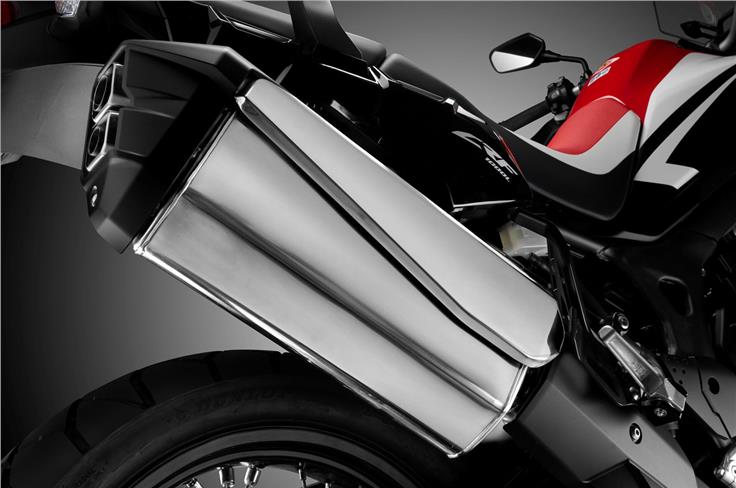 The Africa Twin features a two-into-two exhaust with a unified muffler.