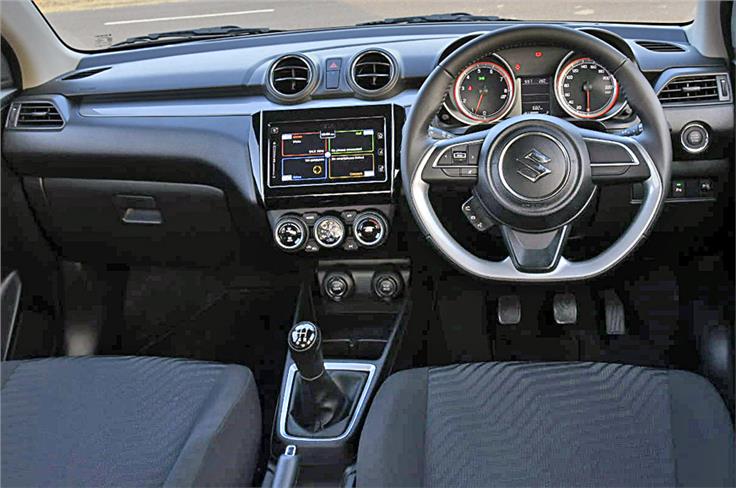 The Swift shares its dashboard design with the Dzire but there are subtle differences. Also, unlike the Dzire that uses a dual-tone colour theme, the Swift follows an all-black look. 
