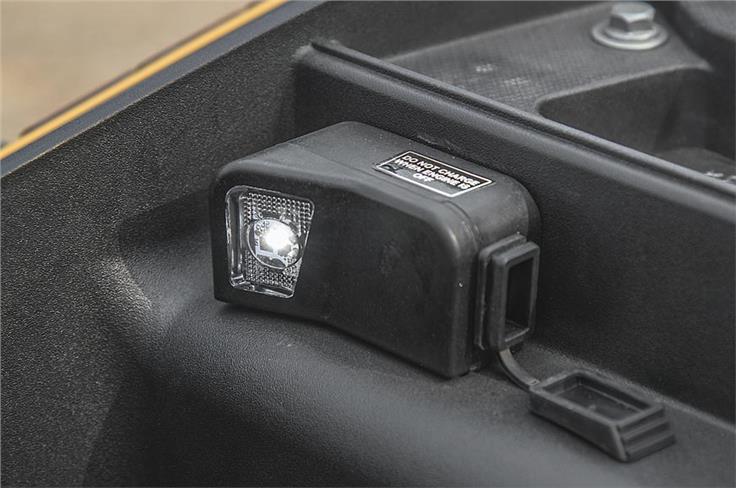 Neatly integrated USB charger and stowage bin light on the TVS Ntorq 125. 
