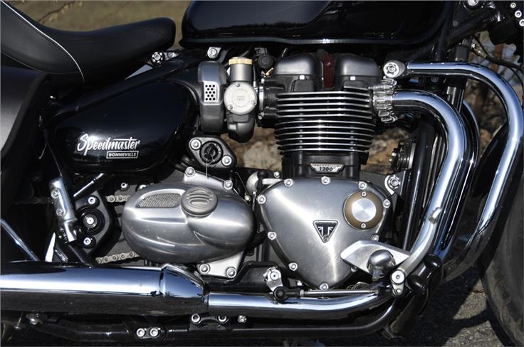 Bobber-sourced 1200cc parallel-twin motor fills up the engine bay neatly. 