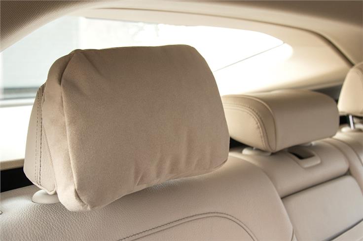 Like the Merc E-class, the 6GT also gets soft pillows for the rear-seat headrests. Great to doze off on.