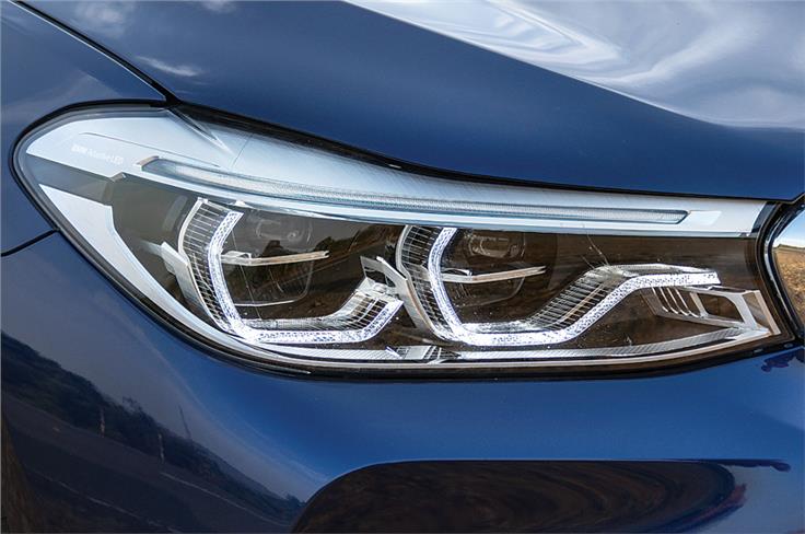 Adaptive LED headlights with auto high beam control are standard.