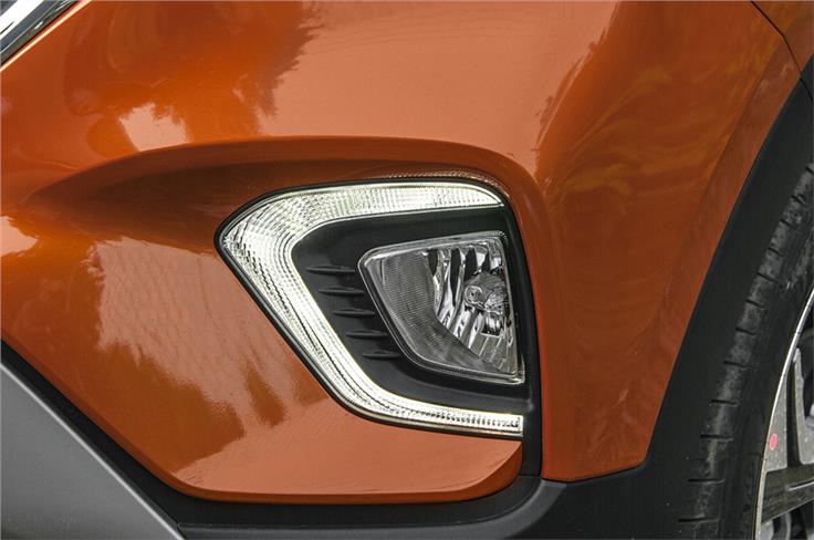 Attractive C-shaped LED DRLs sit on redone bumper. 