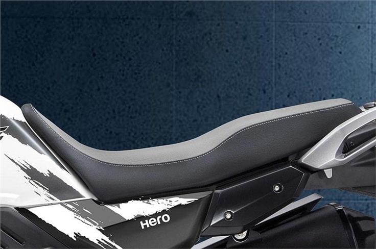 The one-piece seat extends onto the fuel tank, giving it a dual-sport-like appearance.