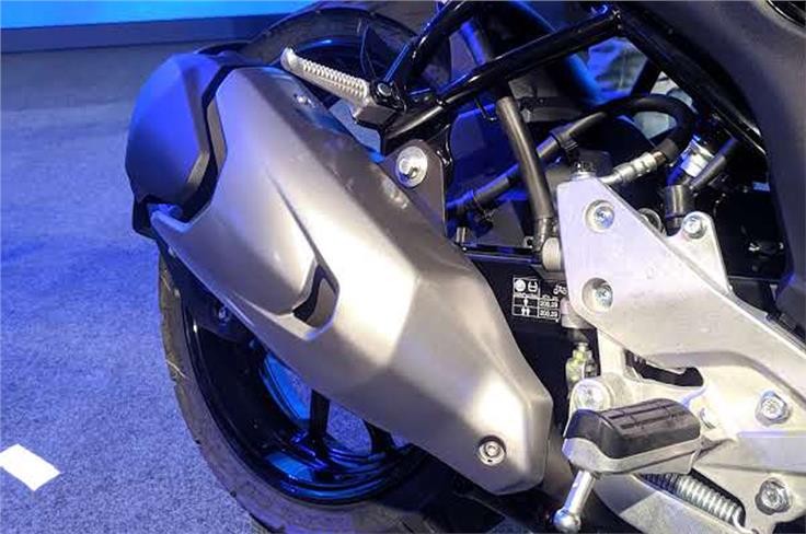 The exhaust muffler has been redesigned and appears larger.