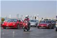 Yohan Poonawalla&#8217;s Ferrari 458 Speciale Aperta seen alongside a vintage Vespa and a Porsche 911.