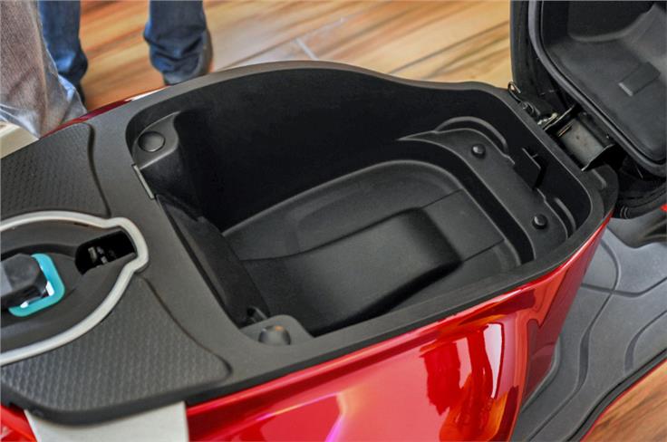Underseat storage is large enough to fit a half-face helmet.