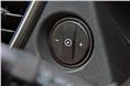 The cruise control switch is positioned on the dashboard. 