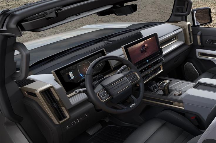 Interior features a 13.4-inch digital infotainment screen and a 12.3-inch digital drive display.
