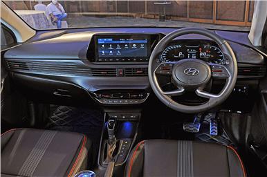 The dashboard is dominated by the free-standing 10.25-inch touchscreen infotainment system.